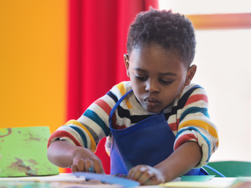 Preschoolers working on an art project together
